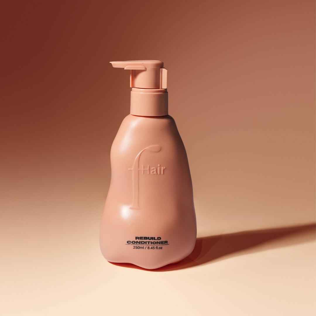 Fhair Rebuild Conditioner 250ml for damaged hair. Deeply nourishes, repairs and smooths hair for soft, shiny and frizz-free results.