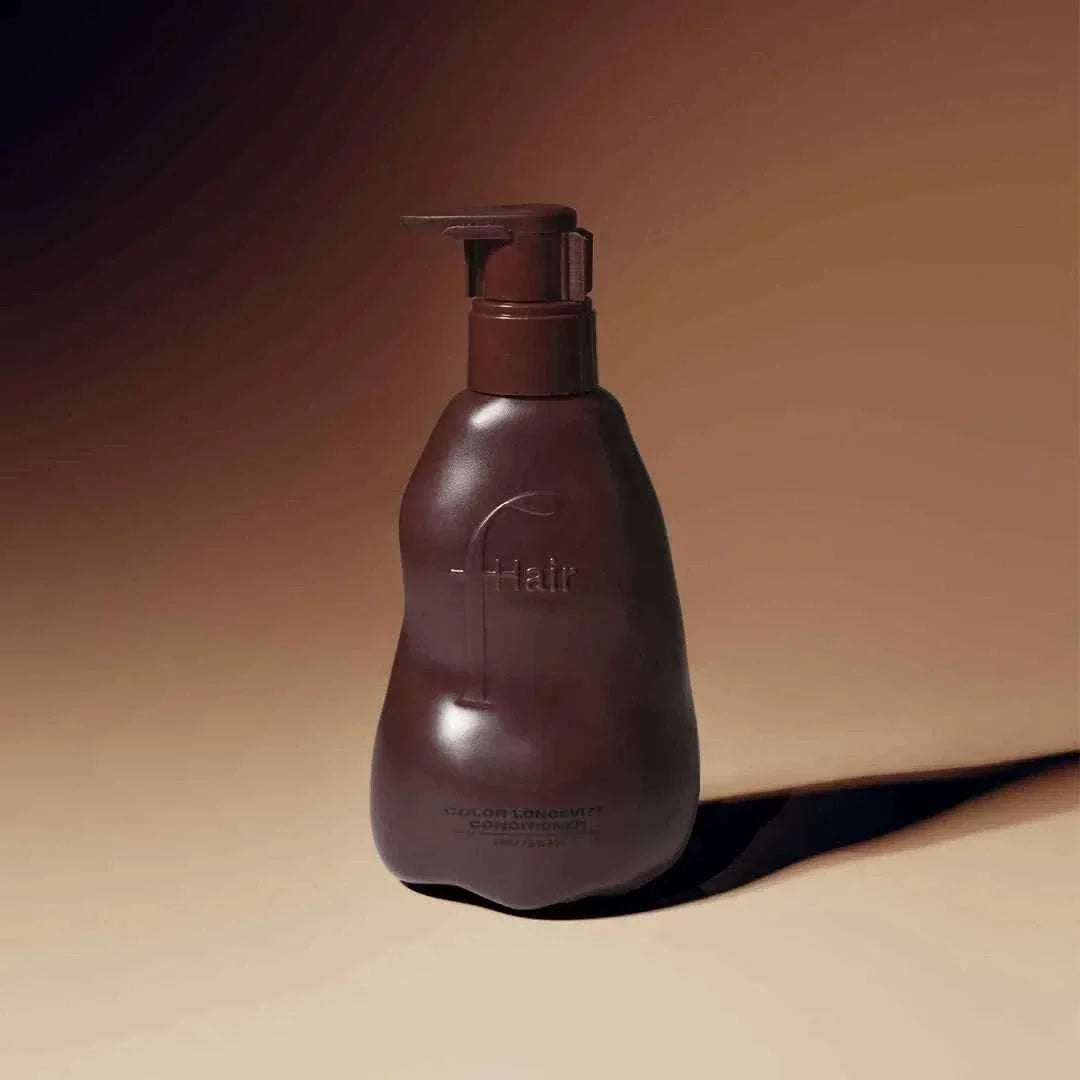 bottle of color longevity conditioner for color-treated or highlighted hair