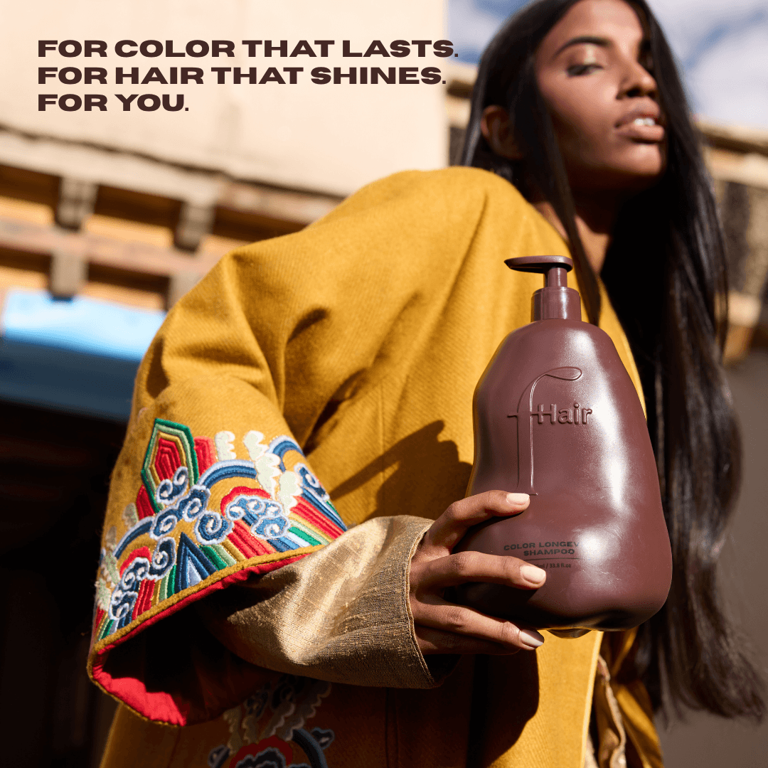 Color Longevity Shampoo bottle with vibrant hair background