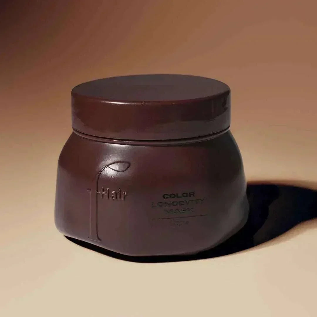 dark brown plastic jar of Color Longevity Mask for color-treated hair with a matte finish and minimal text