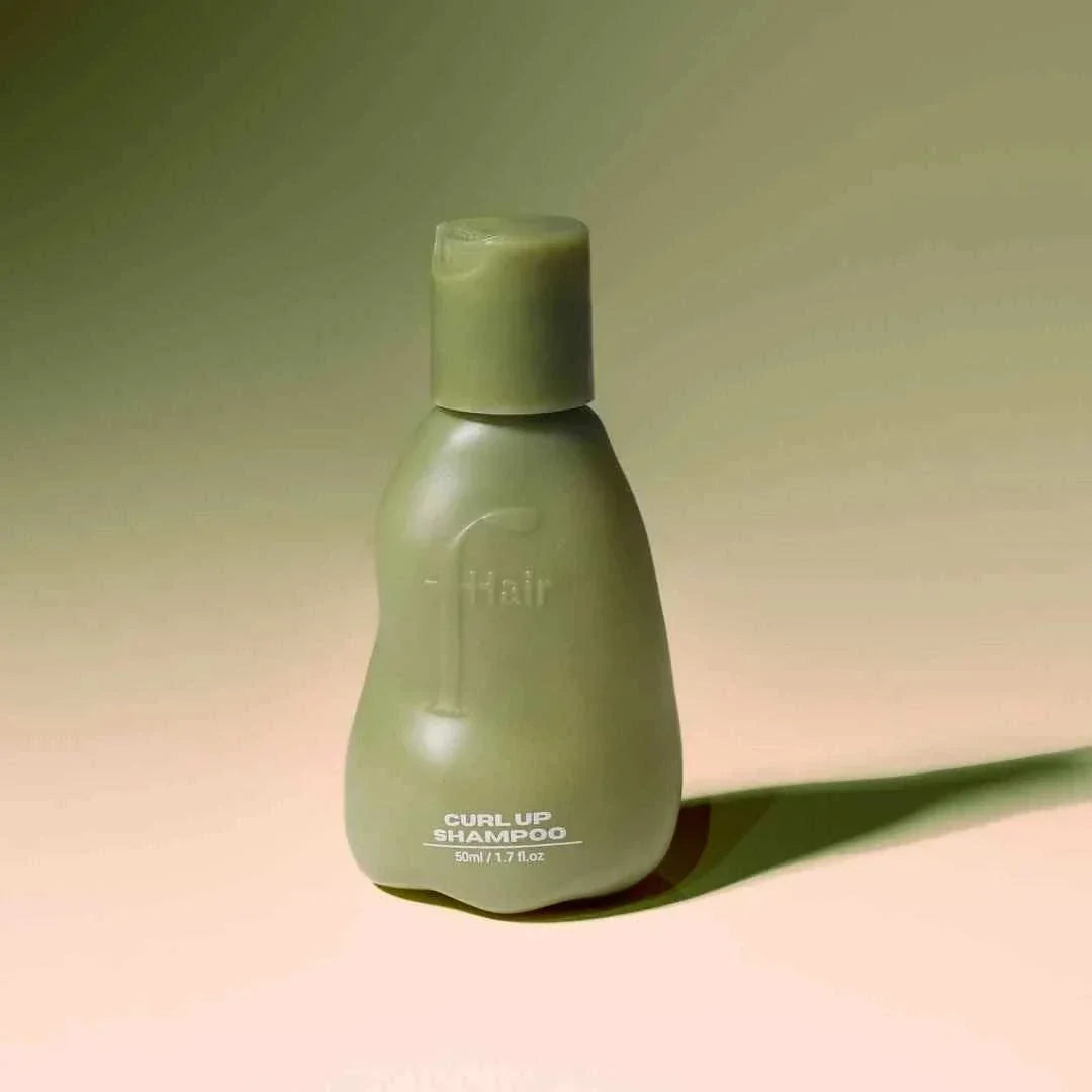 Curl Up Shampoo bottle for defined, frizz-free curls