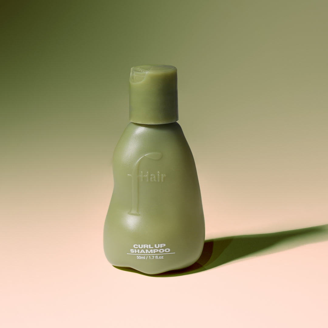 Fhair Curl Up Shampoo for curly hair. Gently cleanses while defining curls, reducing frizz and adding softness and bounce.