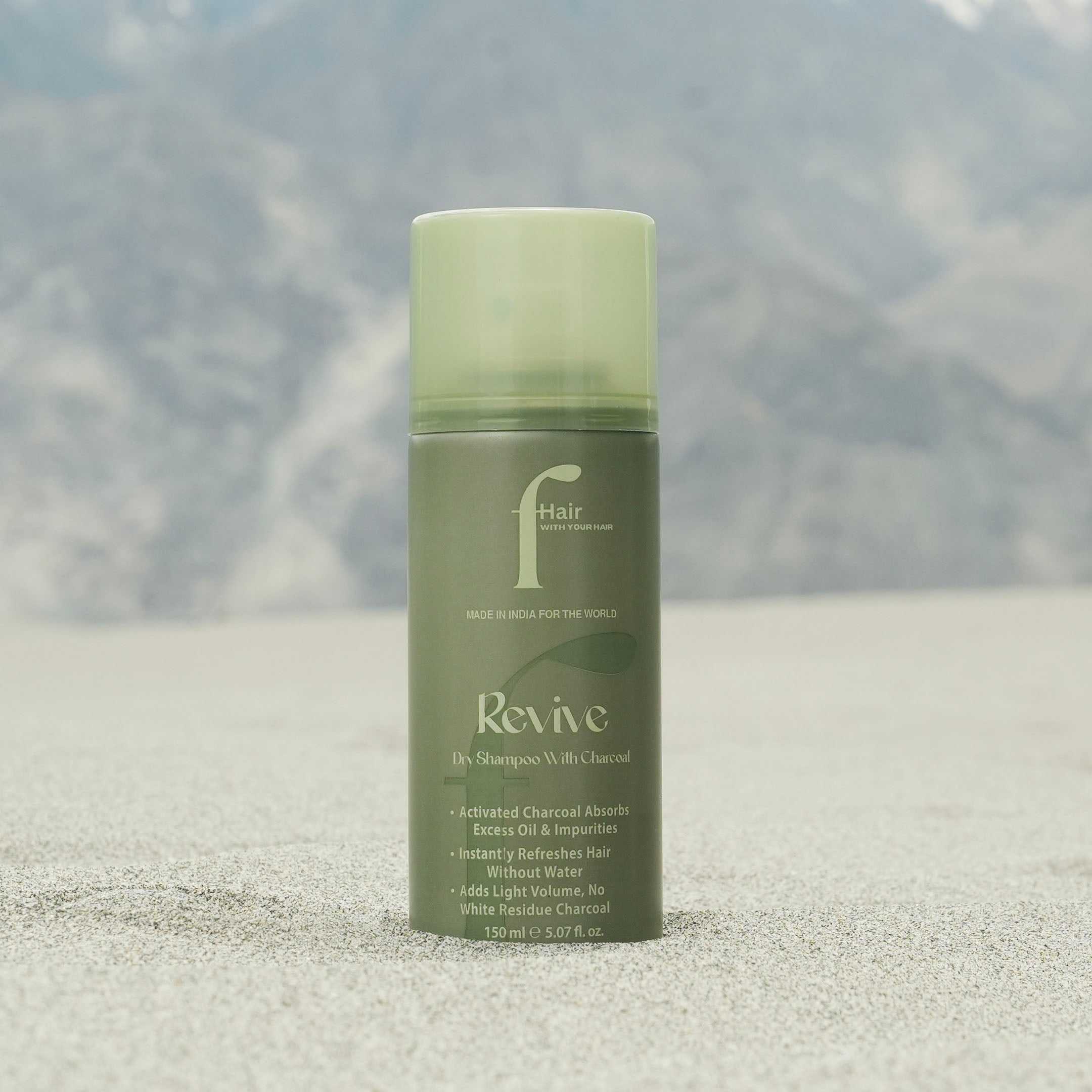 REVIVE charcoal dry shampoo bottle with charcoal and fresh hair