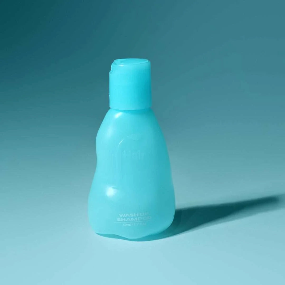 Wash Up Shampoo bottle with fresh mint leaves and water splash